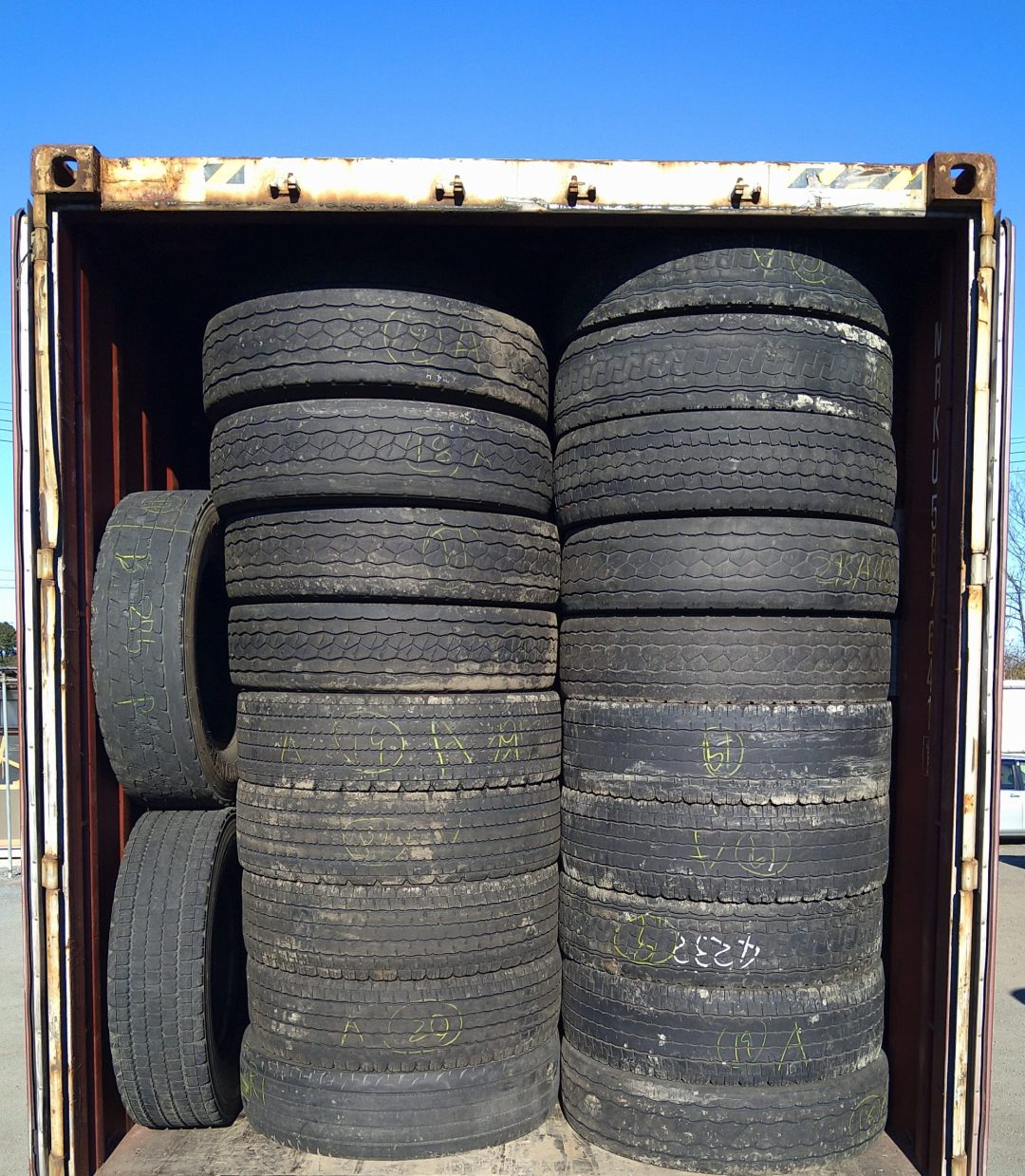used truck tires into a container